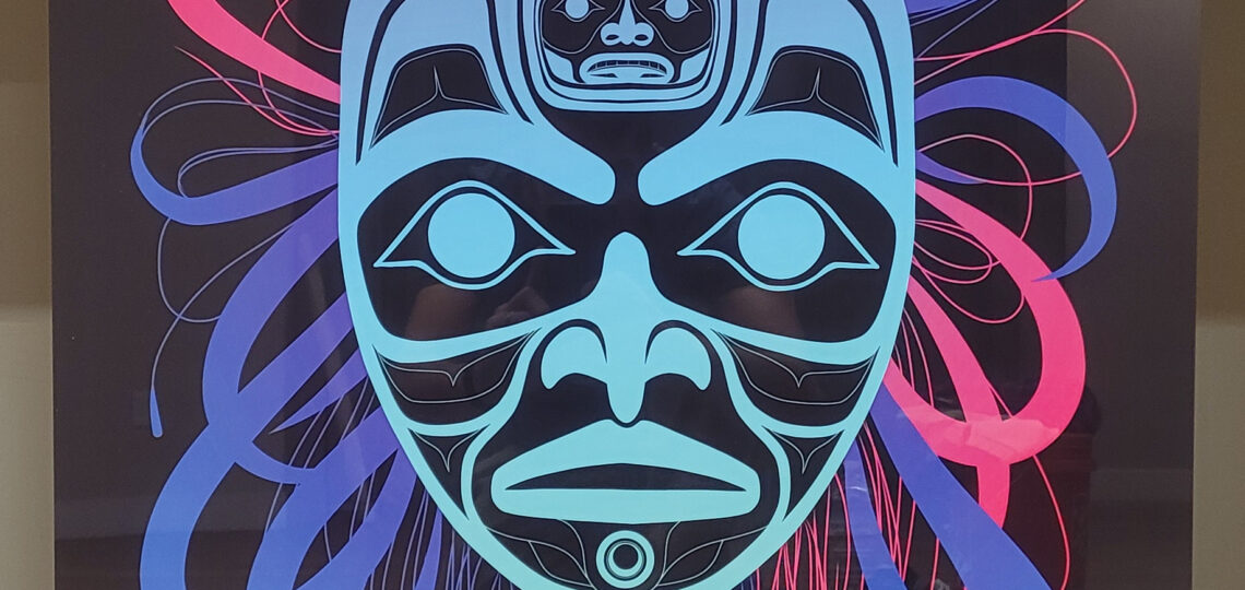 A bear mother shaman mask with strings oscillating and emanating