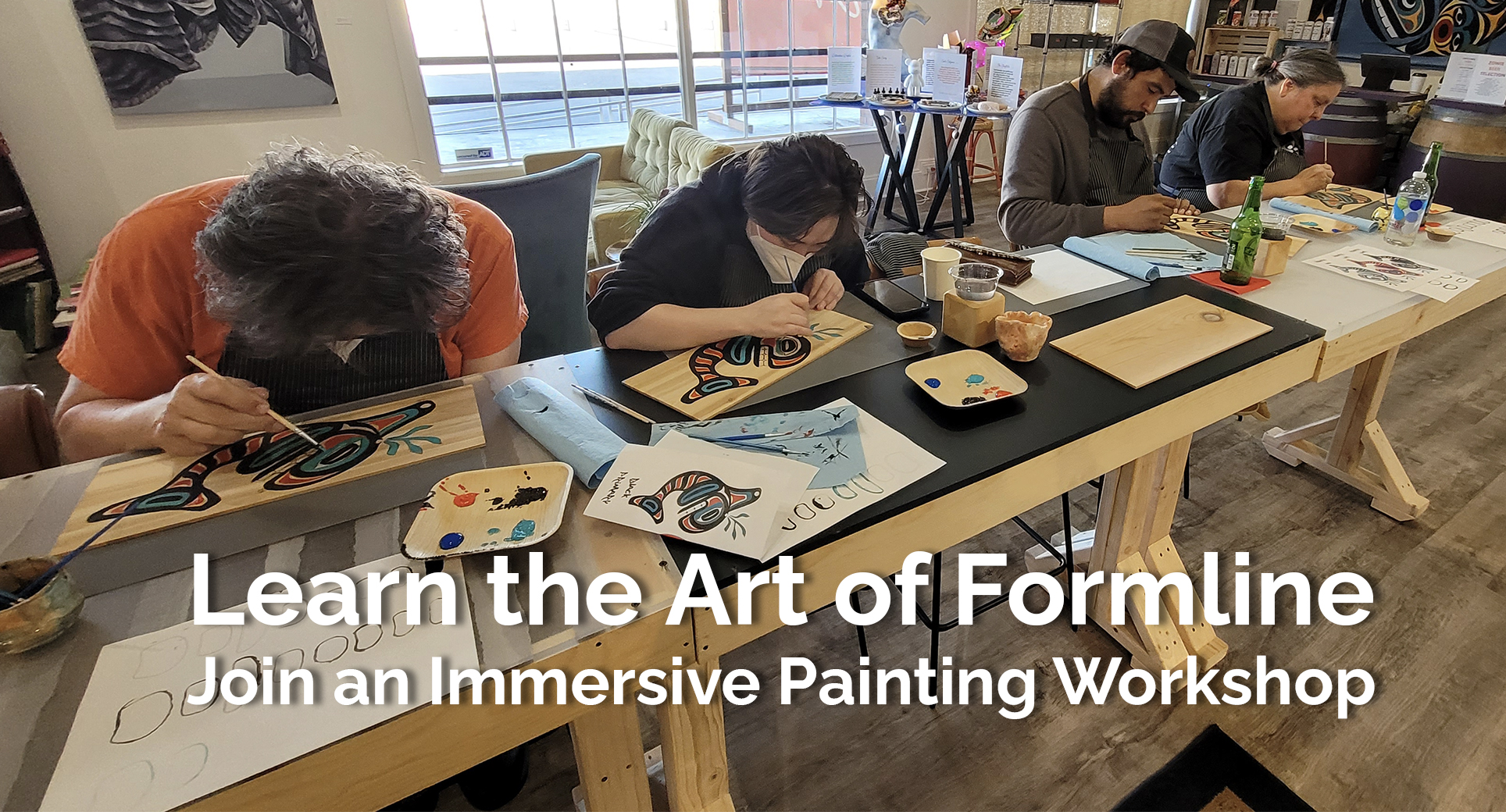 Learn the Art of Formline! Join an Immersive Painting Workshop. Photo of students practicing painting the tradition and ancient Tlingit Norther Formline on PNW Western Red Cedar panels.