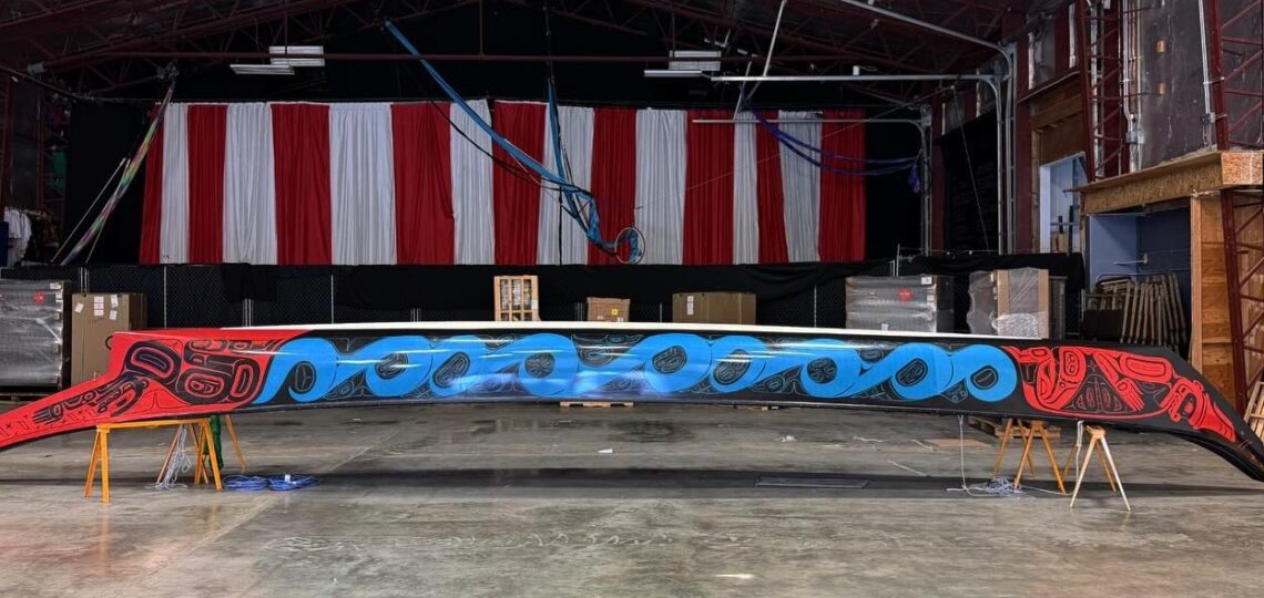 The completed Ancestral Echoes canoe wrap, photographed in the warehouse before transport